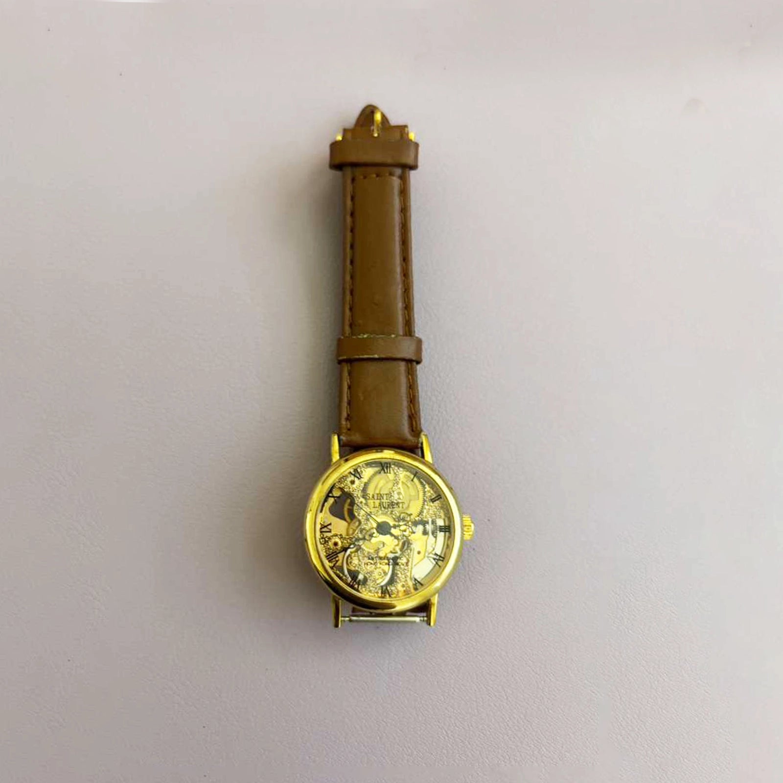 Vintage Saint Laurent Co. Skeleton Mechanical Watch – Gold‑Tone Case, Brown Leather Strap