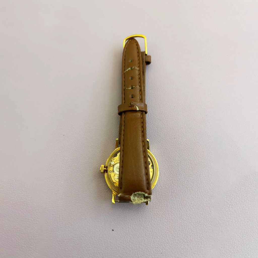 Vintage Saint Laurent Co. Skeleton Mechanical Watch – Gold‑Tone Case, Brown Leather Strap