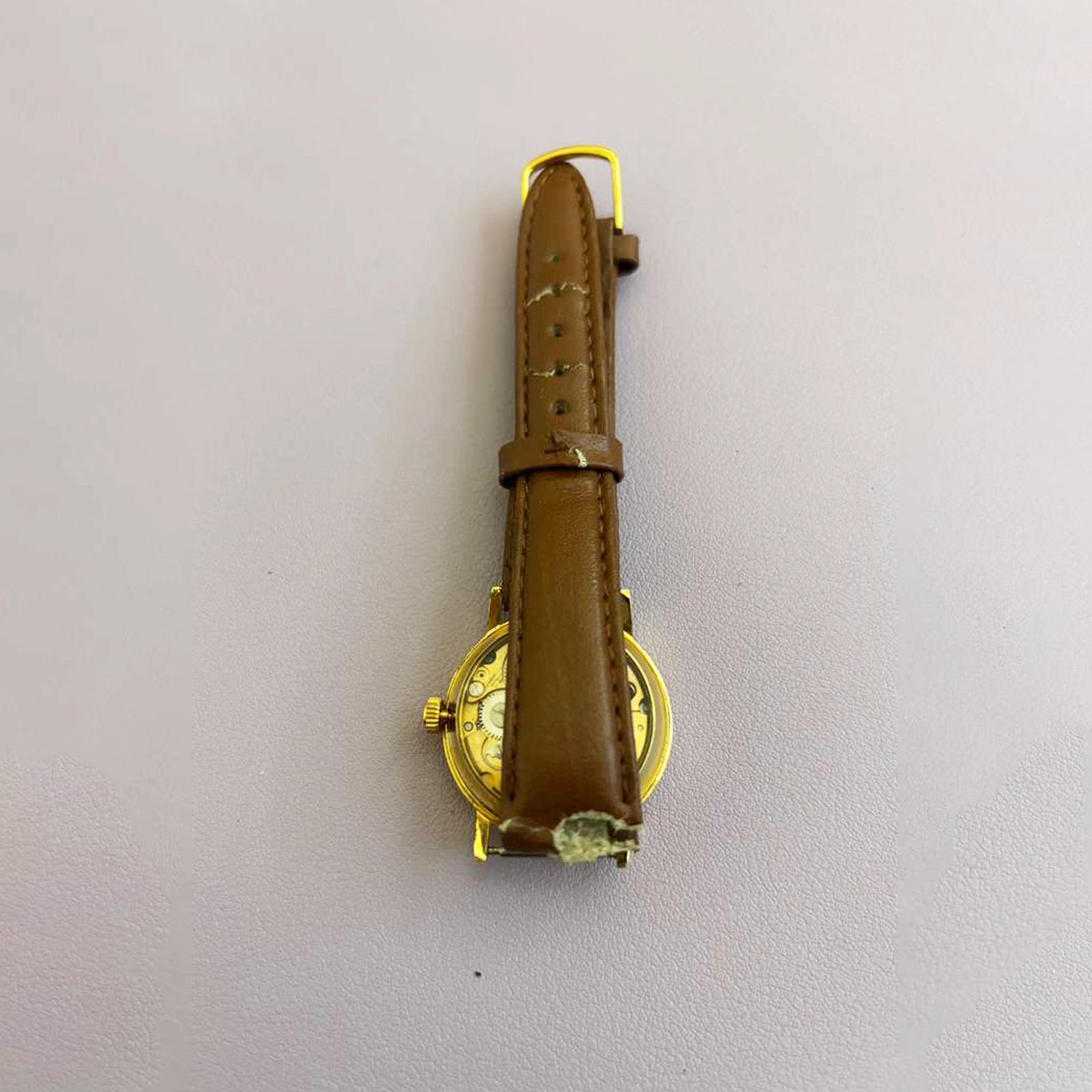 Vintage Saint Laurent Co. Skeleton Mechanical Watch – Gold‑Tone Case, Brown Leather Strap